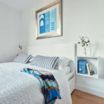Painting in the interior of a bright bedroom