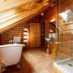 White acrylic bathtub under the skylight