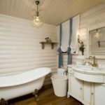 Bright bathroom in the house made of logs