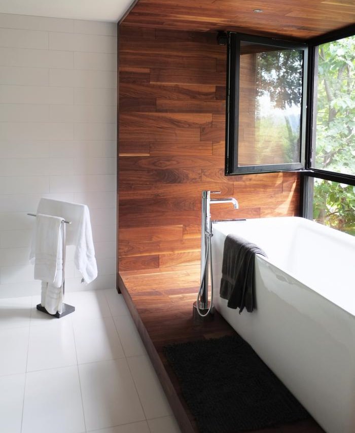 Bathroom on a wooden podium near the window