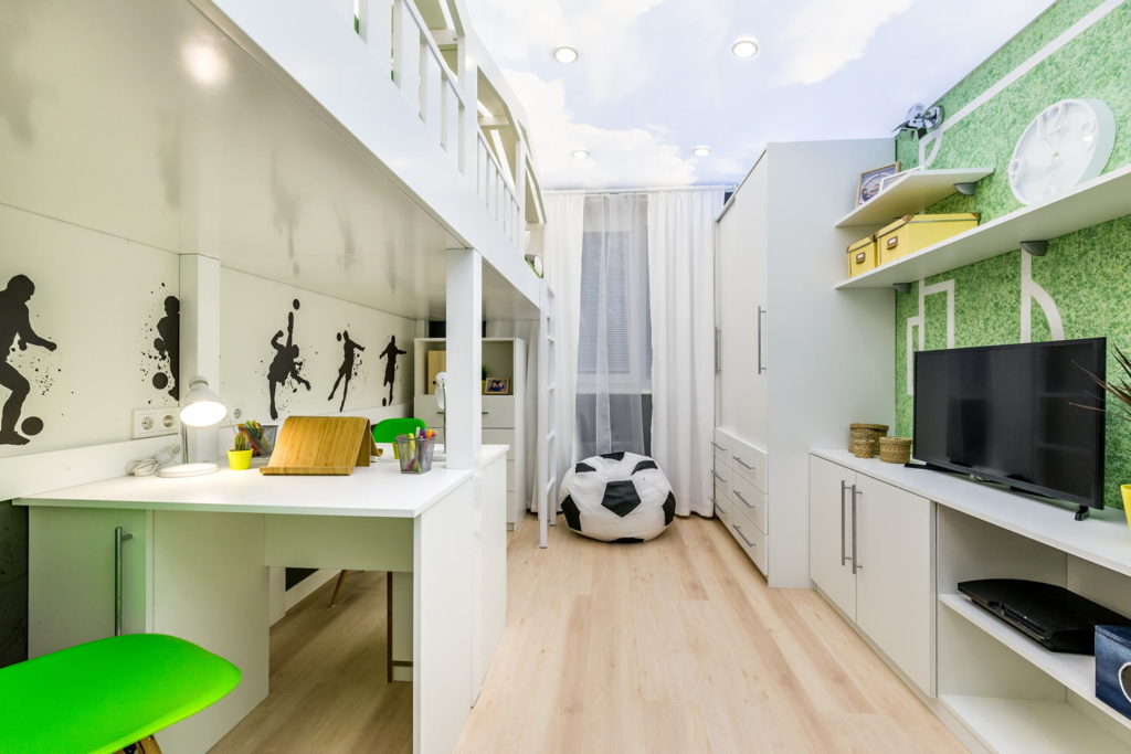The interior of an elongated children's room in white colors