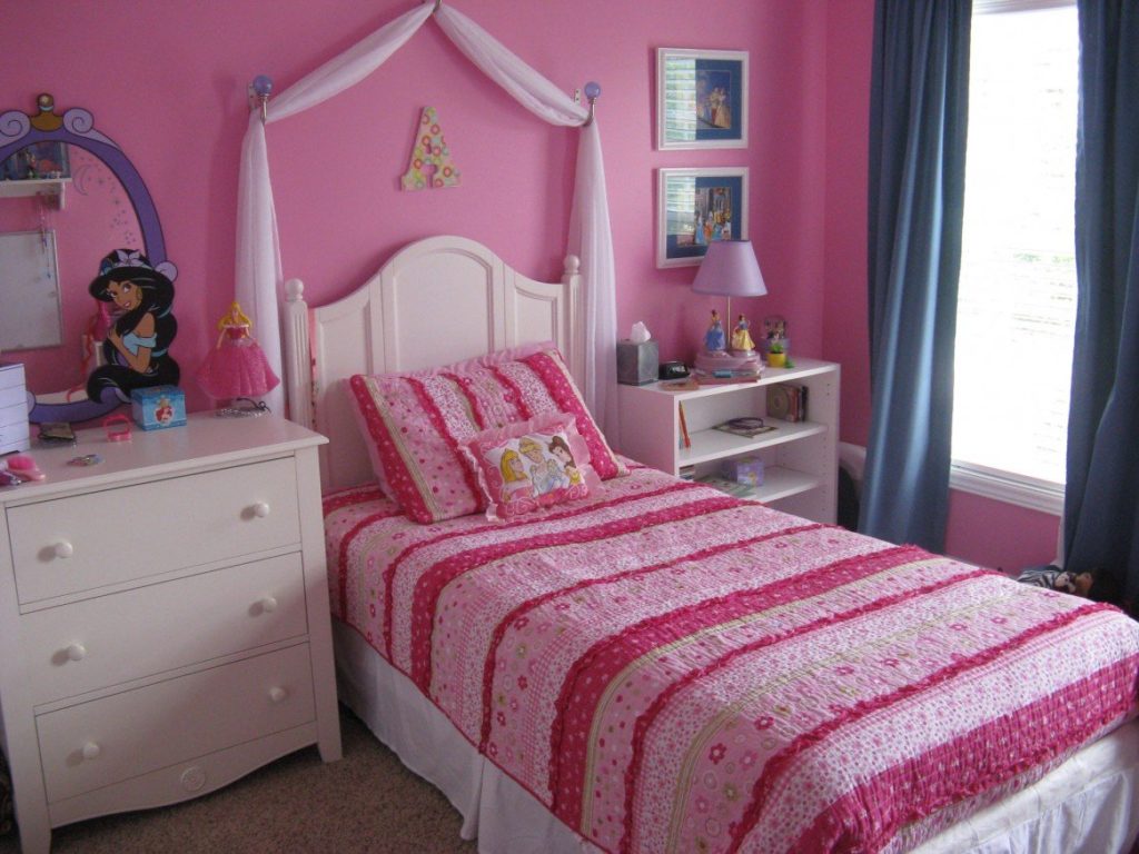The interior of a small children's bedroom in pink