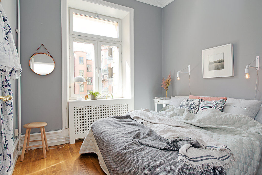 Light gray walls in a small bedroom