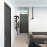 Bicycle on the wall of a narrow corridor