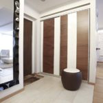 Sliding wardrobe with sliding doors in a spacious entrance hall