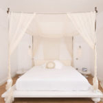 Small four-poster bedroom over the bed