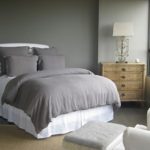 Diagonal bedding in a gray bedroom