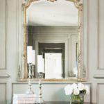 Gold-plated mirror in a classic hallway