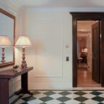 Black and white floor in the entrance hall of the apartment