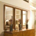 Three modular mirrors on the wall of the corridor