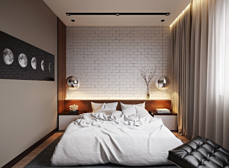 Ķieģeļu siena kompaktas guļamistabas interjerā