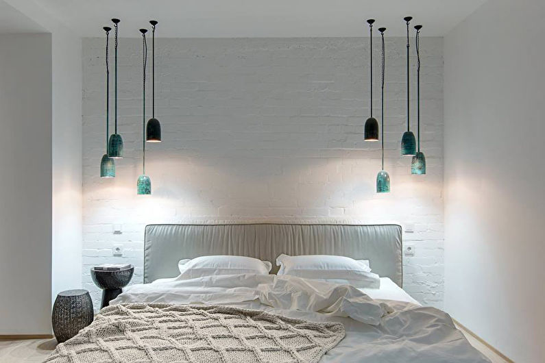 Pendant lights above the bed in the bedroom