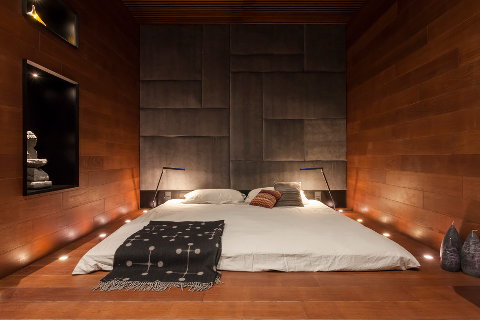 Small Oriental-style spot-lit bedroom