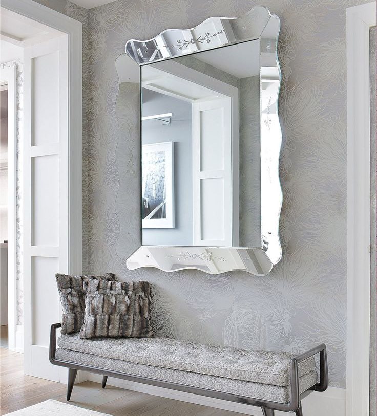 Stylish bench for shoes under the mirror in the hallway