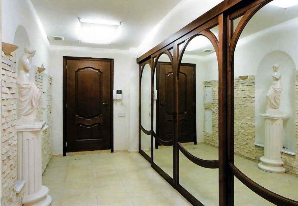 Wardrobe with mirrors in the hallway of the classic style