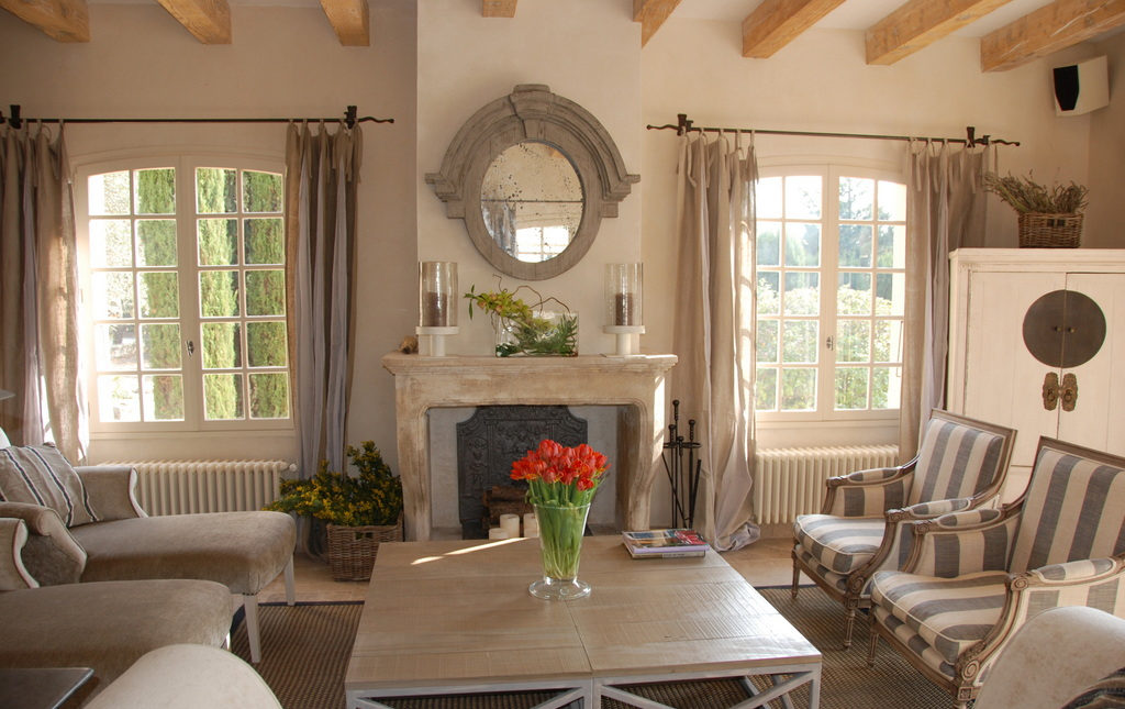 Mirror above the fireplace in the living room of a country house