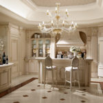 A huge chandelier in the center of the kitchen-dining room