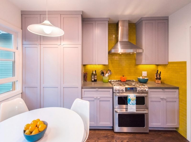 Compact kitchen design with a yellow apron