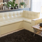 Cozy beige sofa with armrests
