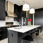 Bright lighting in a black and white kitchen