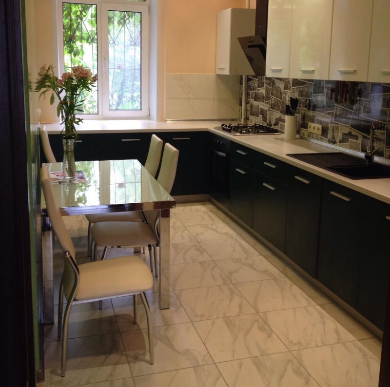 Ceramic floor in beige colors in a small kitchen