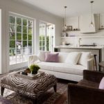 White kitchen-living room with large windows