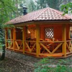 wooden arbor on a stone base