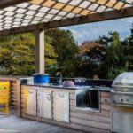 Summer kitchen work area with sink and barbecue