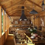 Wooden furniture in an open summer kitchen