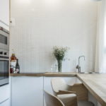 White tile on the kitchen wall