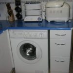 Blue countertop above the washing machine