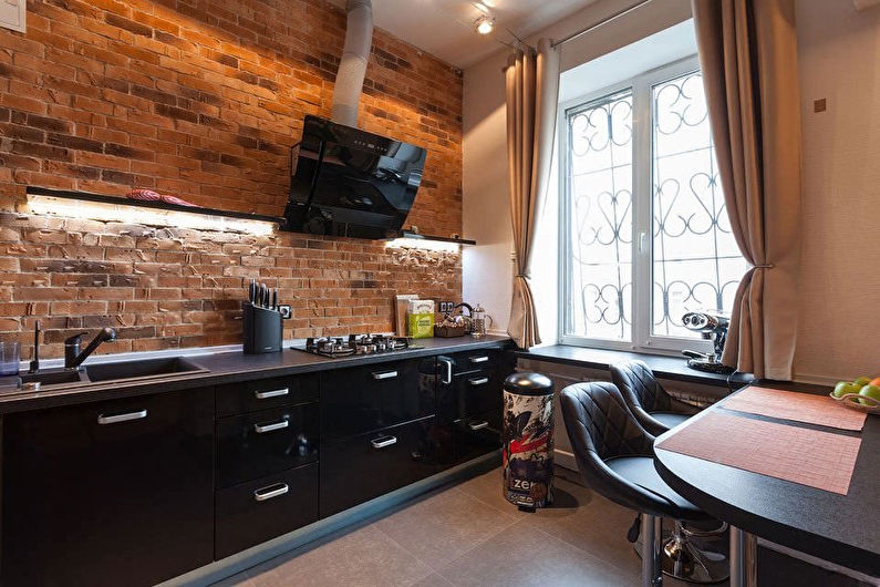 Black loft style kitchen in a city apartment