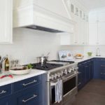 White cooker hood over stainless steel stove