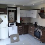 Interior of the kitchen in Khrushchev after combining with the living room