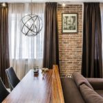 Brown curtains on the windows of the kitchen-living room