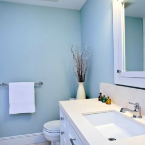 White towel on a background of light blue wall