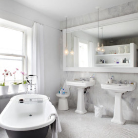 Large mirror above two washbasins