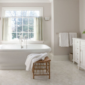 White bathrobe on a wooden chair