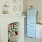 Blue fridge in the corner of the kitchen