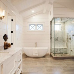 Snow-white interior of a bathroom in a country house