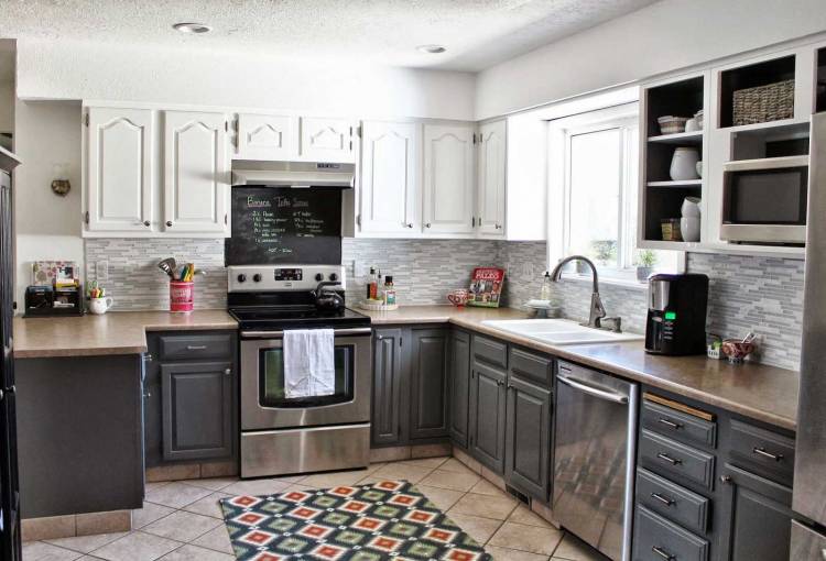 Household appliances from stainless steel in the interior of the kitchen of a private house