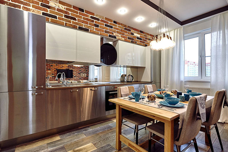 Linear loft-style kitchen with stainless steel facades