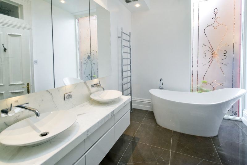 Ceramic bathroom floor with painted walls