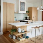 Utensils on the wooden shelves of the kitchen island