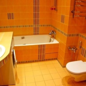 Orange color in the interior of the bathroom