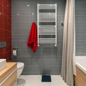 Red towel on a gray wall
