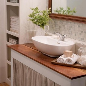 Overhead sink on wooden countertop