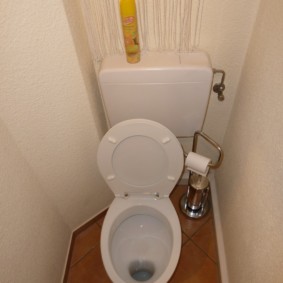 Raised compact toilet lid