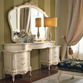 Mirror with a wooden frame in a classic style bedroom