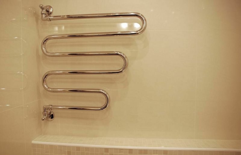 Attaching a heated towel rail to the bathroom wall
